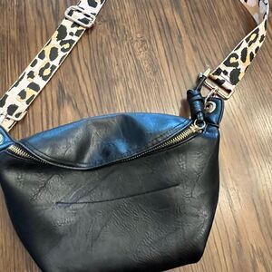 Small black bag w animal print thick guitar removable strap.